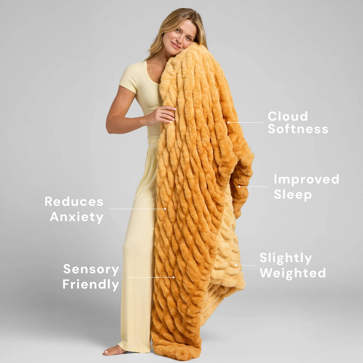 Dreamer plush blanket in a warm golden color showing its textured finish