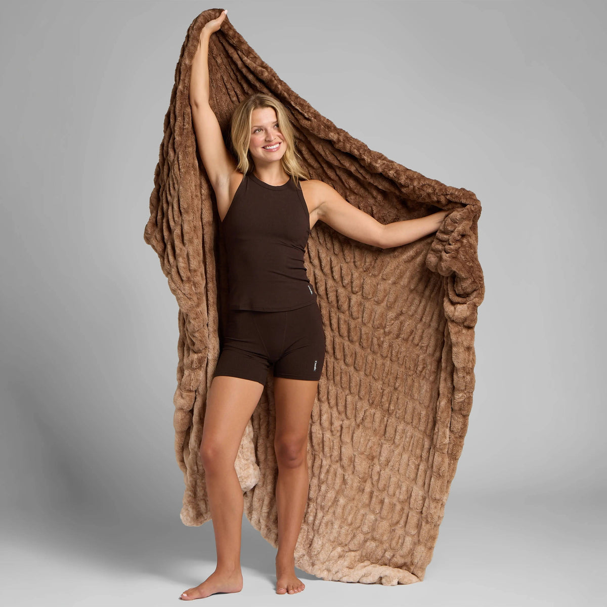Brown Dreamer plush blanket held open